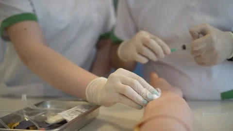 Practicing Syringe - Nursing Education Stock Footage 241564364