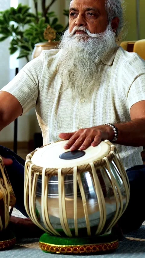 Practicing tabla rhythms at home, Indian mid age man doing riyaz Stock-Footage 342757192