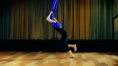 Practicing yoga in the air Stock Footage 38485410