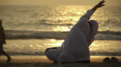 Practicing yoga on Goa beach at sunset Stock Footage 36962413