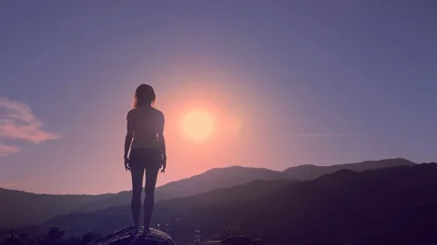 Practicing yoga on mountain peak at sunset Stock Footage 110839035