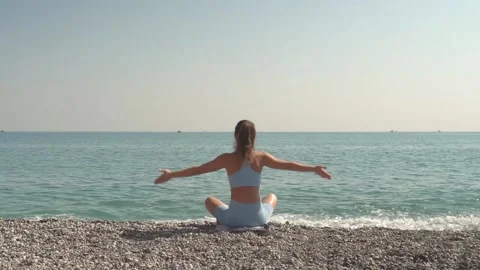 Practicing Yoga By The Sea. Stock Footage 170477282