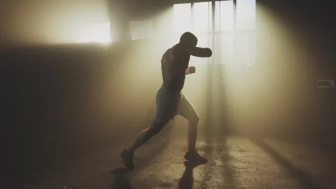 Practising shadow boxing at warehouse Stock Footage 236193051