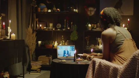 Practising Tarot Reader Learning to Do Layout next to Laptop Stock Footage 247635460
