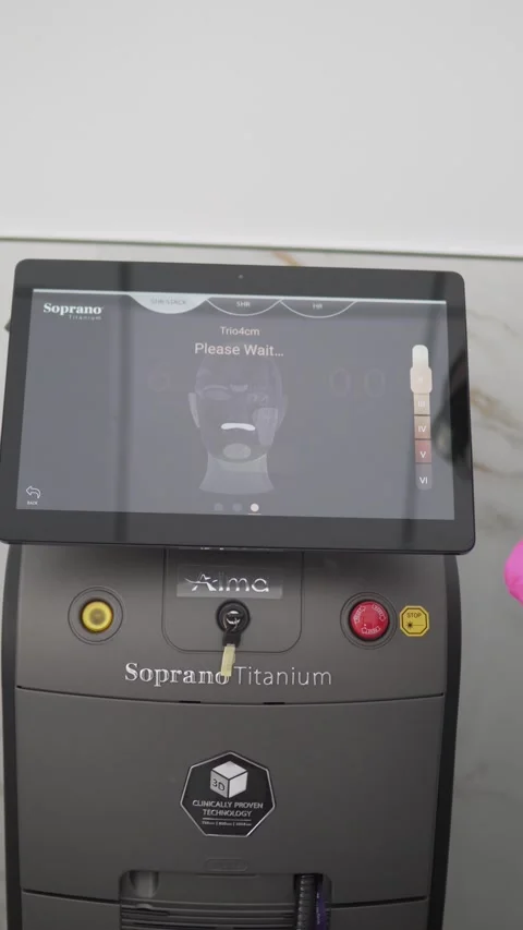 A practitioner demonstrates the Soprano Titanium laser hair removal Stock Footage 307618776