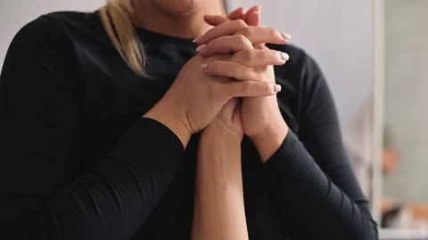 A practitioner performs manual techniques on a patient arm in a clinical Vídeo Stock 344380086