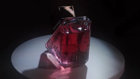 Prada Paradoxe Intense Perfume Rotating on White Surface Backlight Close Up Stock-Footage 334551489