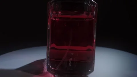 Prada Paradoxe Intense Perfume Rotating on White Surface Backlight Close Up Stock-Footage 334552192