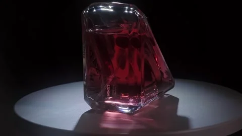 Prada Paradoxe Intense Perfume Rotating on White Surface Backlight Close Up Stock-Footage 334553411