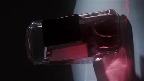 Prada Paradoxe Intense Perfume Rotating on White Surface Backlight Close Up Stock-Footage 334553496