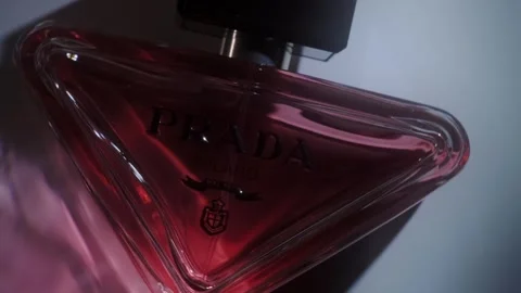 Prada Paradoxe Intense Perfume Rotating on White Surface Backlight Close Up Stock-Footage 334555054