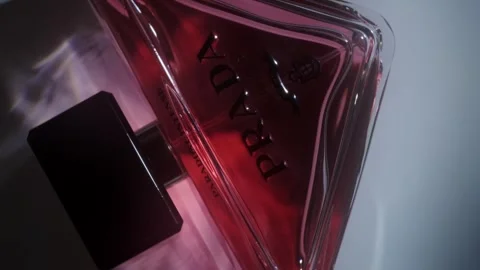 Prada Paradoxe Intense Perfume Rotating on White Surface Backlight Close Up Stock-Footage 334555707