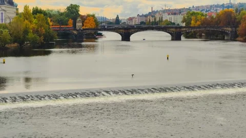 Prague Autumn River View in 4K Slow Motion Historic Bridge Stock Footage 319035342