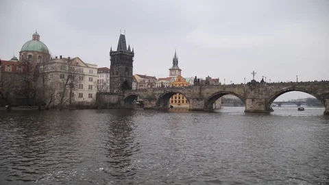 Prague. Charles Bridge, beautiful camera movement along the water. 4K Slow Mo Stock Footage 107825547