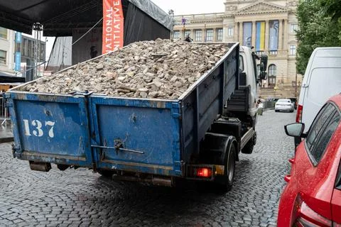 Prague, CZ 01.06.2024: Self Loading container with heavy construction debri.. Stock Photos