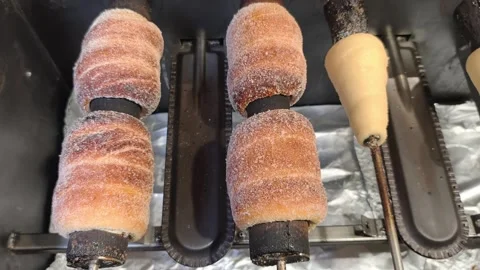 Prague, Czech Republic – February 13, 2026: Trdelnik pastries rotating Stock Footage 328843953
