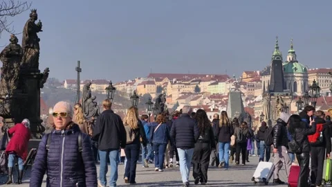 Prague, Czech Republic – March 5, 2026: Charles Bridge Tourists and Artists Stock Footage 330187682