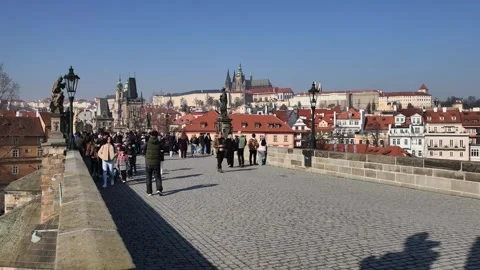 Prague, Czech Republic – March 5, 2026: Charles Bridge Tourists and Artists Stock Footage 330188932