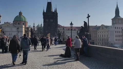 Prague, Czech Republic – March 5, 2026: Charles Bridge Tourists and Artists Stock Footage 330189007