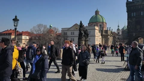 Prague, Czech Republic – March 5, 2026: Charles Bridge Tourists and Artists Stock Footage 330189009
