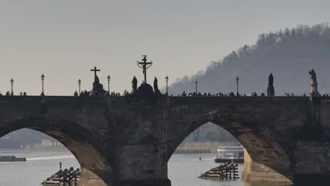 Prague, Czech Republic – March 5, 2026: Charles Bridge Tourists and Artists Stock Footage 330189062