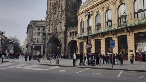 Prague, Czech Republic - March 8, 2026: Tourists explore in urban mobility hub Stock Footage 330338902