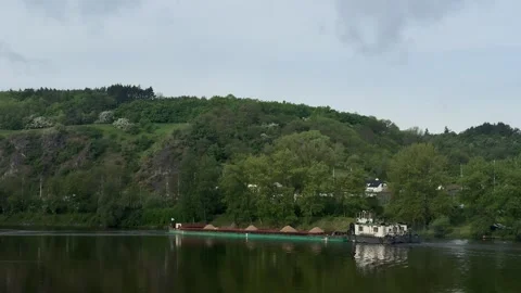 Prague, Czech Republic - May 11, 2026 - heavy industrial push boat navigates a Stock Footage 334951404