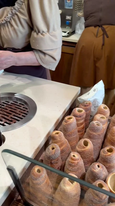 Prague, Czech Republic - September 15, 2023: Trdelnik Baked and Served Stock Footage 344602289