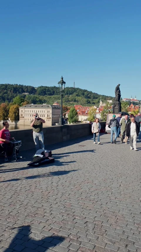 Prague, Czech Republic – September 23, 2026: Musicians on Charles Bridge Stock Footage 346289962