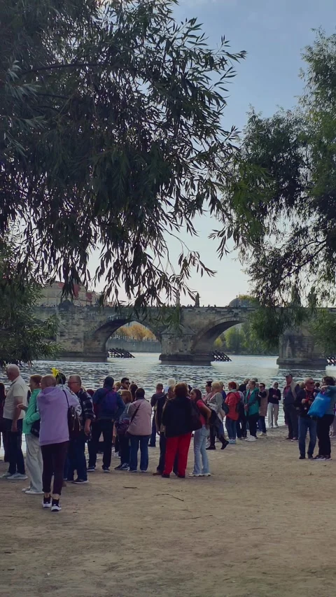 Prague, Czech Republic – September 23, 2026: Tourists photo Charles Bridge Stock Footage 346290041