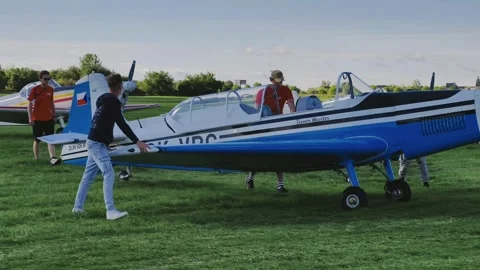 Prague, Czech Republic – September 5, 2026: Men Moving Aircraft 4K Footage Видео 345059635