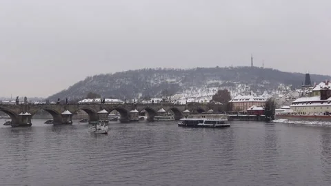 Prague, Czechia - January 7, 2024 -  Boats and Charles Bridge Stock Footage 292385553