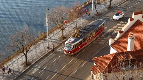 Prague - Elevated street view with people, cars and tram passing by. 4K Stock Footage 104636532