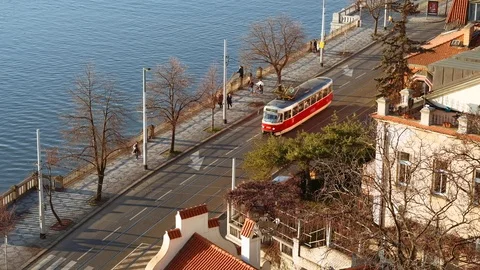 Prague - Elevated street view with people, cars and tram passing by. 4K Stock Footage 104639266