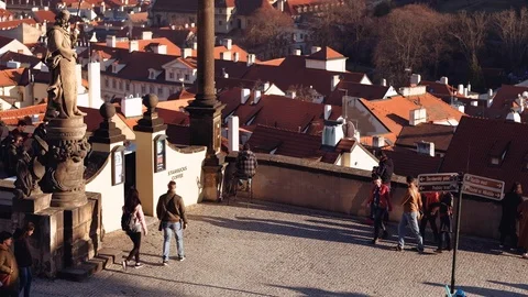 Prague - Elevated view of tourists walking at Castle District with red roofs Stock Footage 104647778