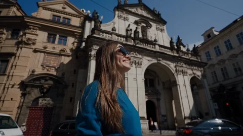 PRAGUE, MAY 15, 2019: Cute young smiling girl in sunglass looks around at 스톡 동영상 115223733