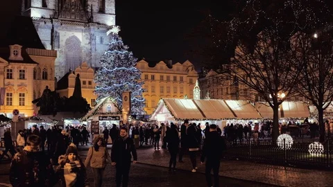Prague- Night view of Old Town Square with glowing Christmas tree and people. 4K Stock Footage 100320011