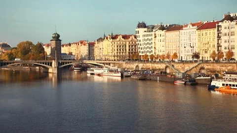 Prague - Old Town view with river, docking boats, bridge and traffic in evening Stock Footage 98906438