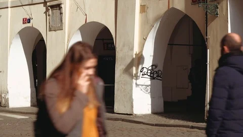 Prague - People walking in  front of arcade at Old Town. 4K resolution Stock Footage 104715740