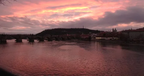 Prague Sunset View of Charles Bridge Petrin Tower and Nicholas Church Stock Footage 142954101
