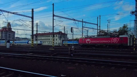 Prague Train Station, Train Engine enter Station, zoom out, Europe Station Stock Footage 256043052