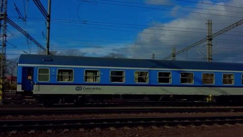 Prague Train Station, Train leaving the Station, blue sky with clouds Stock Footage 256043054