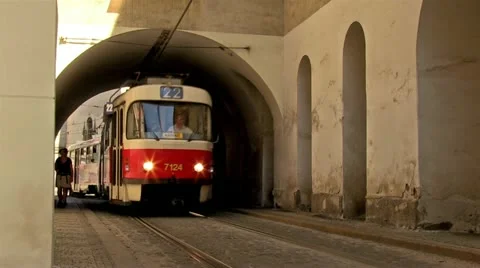 Prague tram going through the arch towards Stock Footage 21894668