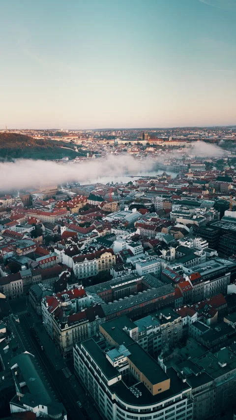 Prague vertical drone view at sunrise, clouds over Danube River, Czech Republic Stock Footage 304989245