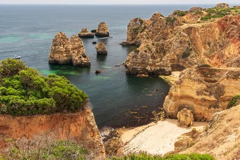 Praia do Camilo beach between the cliffs near the city of Lagos, Algarve, P.. Stock Photos
