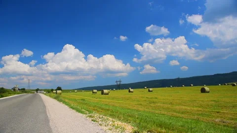 Prairie, Fields, a Straight Road, and Clouds in the Blue Sky Vídeos de archivo 330633523