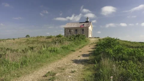 Prairie school with flag on hill Stock Footage 138652509