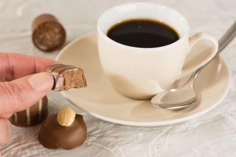 Praline and coffee Stock Photos