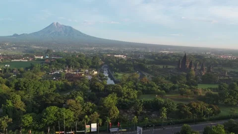 Prambanan temple and Merapi Mountain view in the morning Stock Footage 297147356