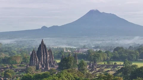 The Prambanan temple in Java with the Merapi volcano in the background. 動画素材 307304812
